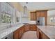 Well-equipped kitchen with granite countertops, stainless steel appliances, and custom cabinetry at 360 N Point Rd, Osprey, FL 34229