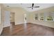 Bright bedroom with hardwood floors, offering access to bathroom at 360 N Point Rd, Osprey, FL 34229