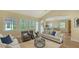Spacious living room with hardwood floors, neutral decor, and ample natural light at 360 N Point Rd, Osprey, FL 34229