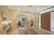 Elegant entryway with round table, view into living room, and wood floors at 360 N Point Rd, Osprey, FL 34229