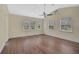 Spacious bedroom featuring hardwood floors and multiple windows at 360 N Point Rd, Osprey, FL 34229