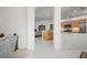 Open kitchen with a breakfast bar and view to the living area at 5249 Far Oak Cir, Sarasota, FL 34238