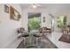 Bright breakfast nook with table and chairs, adjacent to a screened porch at 5249 Far Oak Cir, Sarasota, FL 34238