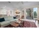 Open living room showcasing a view to the kitchen and screened lanai at 5249 Far Oak Cir, Sarasota, FL 34238