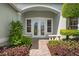 Inviting front entrance with double doors and landscaped walkway at 5249 Far Oak Cir, Sarasota, FL 34238