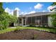Home with a screened porch and landscaped backyard at 5249 Far Oak Cir, Sarasota, FL 34238