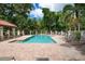 Inviting community pool with lounge chairs at 5249 Far Oak Cir, Sarasota, FL 34238