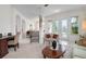 Bright living room with ample natural light and access to a screened patio at 5249 Far Oak Cir, Sarasota, FL 34238