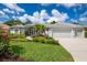 Two-story home with a two-car garage and lush landscaping at 5249 Far Oak Cir, Sarasota, FL 34238