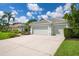 Two-car garage with a long driveway at 5249 Far Oak Cir, Sarasota, FL 34238
