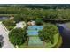 Aerial view of community amenities including pool, tennis, and basketball court at 5249 Far Oak Cir, Sarasota, FL 34238