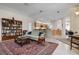 Living area with a view into kitchen and access to screened lanai at 5249 Far Oak Cir, Sarasota, FL 34238