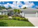 Two-story home with a two-car garage and lush landscaping at 5249 Far Oak Cir, Sarasota, FL 34238