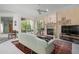 Living room boasts a fireplace, large windows, and ample natural light at 5249 Far Oak Cir, Sarasota, FL 34238