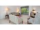 Spacious living room featuring comfortable seating and access to a screened porch at 5249 Far Oak Cir, Sarasota, FL 34238