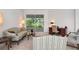 Relaxing living room with a view of the screened-in patio at 5249 Far Oak Cir, Sarasota, FL 34238