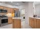 Modern kitchen with stainless steel appliances and an island at 5249 Far Oak Cir, Sarasota, FL 34238