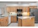 Spacious kitchen with an island and stainless steel appliances at 5249 Far Oak Cir, Sarasota, FL 34238