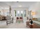 Bright and airy living room with ample seating and natural light at 5249 Far Oak Cir, Sarasota, FL 34238