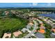 Aerial view of a single-Gathering home in a residential neighborhood at 5249 Far Oak Cir, Sarasota, FL 34238