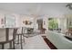 Open living space with a view into the kitchen and screened porch at 5249 Far Oak Cir, Sarasota, FL 34238