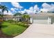 Single-story home with attached garage and well-manicured lawn at 5249 Far Oak Cir, Sarasota, FL 34238