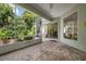 Spacious screened porch with brick pavers and access to backyard at 5249 Far Oak Cir, Sarasota, FL 34238