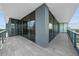 Large balcony with glass railing and tile flooring providing ample space for outdoor enjoyment and scenic views at 2912 W Santiago St # 2004, Tampa, FL 33629