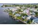 Aerial view of a waterfront property showcasing the home's location with deep water access and surrounding community at 508 65Th St, Holmes Beach, FL 34217