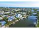 Aerial view of a waterfront neighborhood, showcasing the home's location with deep water access and surrounding community at 508 65Th St, Holmes Beach, FL 34217