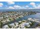 Aerial shot of waterfront home with boat dock, gorgeous water views, and beautiful neighborhood at 508 65Th St, Holmes Beach, FL 34217