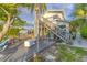 Backyard with a patio, outdoor seating, steps, and lush greenery, ideal for relaxation and entertainment at 508 65Th St, Holmes Beach, FL 34217