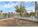 Backyard with dock swing, and canal views, an idyllic outdoor retreat at 508 65Th St, Holmes Beach, FL 34217