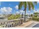 Scenic view from a wooden deck, showcasing lush greenery and a canal waterway on a sunny day at 508 65Th St, Holmes Beach, FL 34217