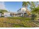 Expansive backyard with a large deck and outdoor seating area, along with stairs leading to a balcony at 508 65Th St, Holmes Beach, FL 34217