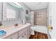 Bright bathroom features a vanity, a shower-tub combo, and nautical decor at 508 65Th St, Holmes Beach, FL 34217