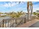 Stairs leading to wooden deck with water views, adjacent to the canal at 508 65Th St, Holmes Beach, FL 34217