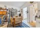 Dining area with seating for four, nautical decor, and a doorway to the bathroom at 508 65Th St, Holmes Beach, FL 34217