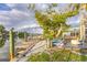 Scenic view of a wooden dock extending into the water, accompanied by an outdoor lounge area on the property at 508 65Th St, Holmes Beach, FL 34217