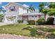 Charming two-story home with a well-maintained lawn and pink shutters at 508 65Th St, Holmes Beach, FL 34217