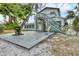 Exterior of a two-story house featuring a deck and beautiful landscaping at 508 65Th St, Holmes Beach, FL 34217