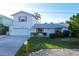 Picture of an inviting single-Gathering home with a manicured lawn and charming pink shutters at 508 65Th St, Holmes Beach, FL 34217