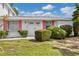 Home exterior showcasing the charming front entrance with double doors and vibrant landscaping at 508 65Th St, Holmes Beach, FL 34217