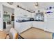 Bright kitchen features white cabinets, a ceiling fan, and modern appliances at 508 65Th St, Holmes Beach, FL 34217