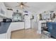 Functional kitchen boasts white appliances, a ceiling fan, and bright lighting at 508 65Th St, Holmes Beach, FL 34217