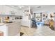Bright kitchen open to living area, featuring white appliances at 508 65Th St, Holmes Beach, FL 34217
