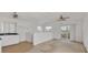 Open living area with waterfront views from sliding glass doors to the outdoor deck at 508 65Th St, Holmes Beach, FL 34217