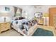 Inviting main bedroom with a bed, a vanity and a walk-in closet at 508 65Th St, Holmes Beach, FL 34217