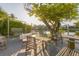 Outdoor seating area featuring a waterfront view and a shade tree, great for relaxing or entertaining at 508 65Th St, Holmes Beach, FL 34217