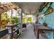 Inviting outdoor patio with dining set, grill, and nautical decor, perfect for entertaining or relaxing at 508 65Th St, Holmes Beach, FL 34217